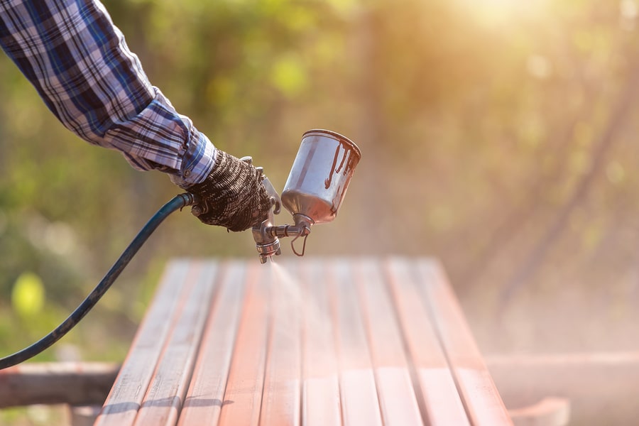 specialist waterproofing contractors spraying wood